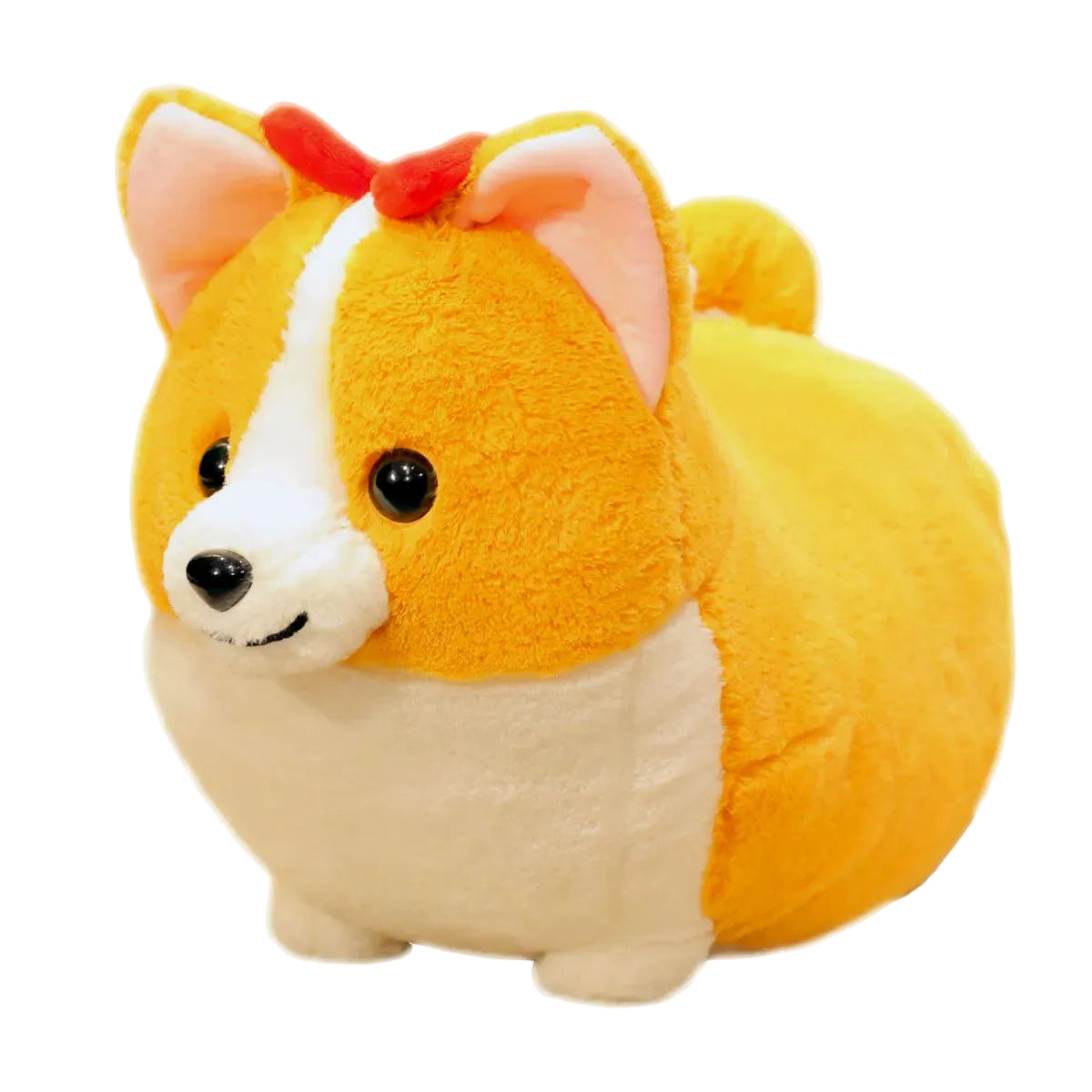 A plush toy shaped like a corgi dog, with a yellow-orange body, white chest and face stripe, pink inner ears, and a small red bow on top, photographed on a plain white background.