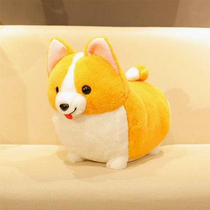 A round, corgi plush toy with a yellow-orange and white color scheme, sitting on a beige sofa.