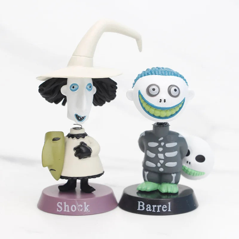 Two animated character figurines labeled 'Shock' and 'Barrel' on a white background