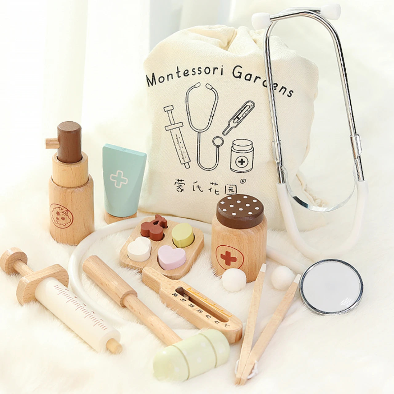 Montessori educational tools including a stethoscope, wooden toys, and a bag labeled 'Montessori Gardens' on a white background.