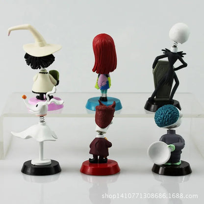 Set of animated character figurines on a white background