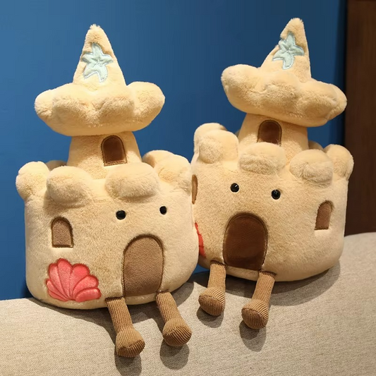 Two plush sandcastle toys with star-shaped roofs on a blue and beige background