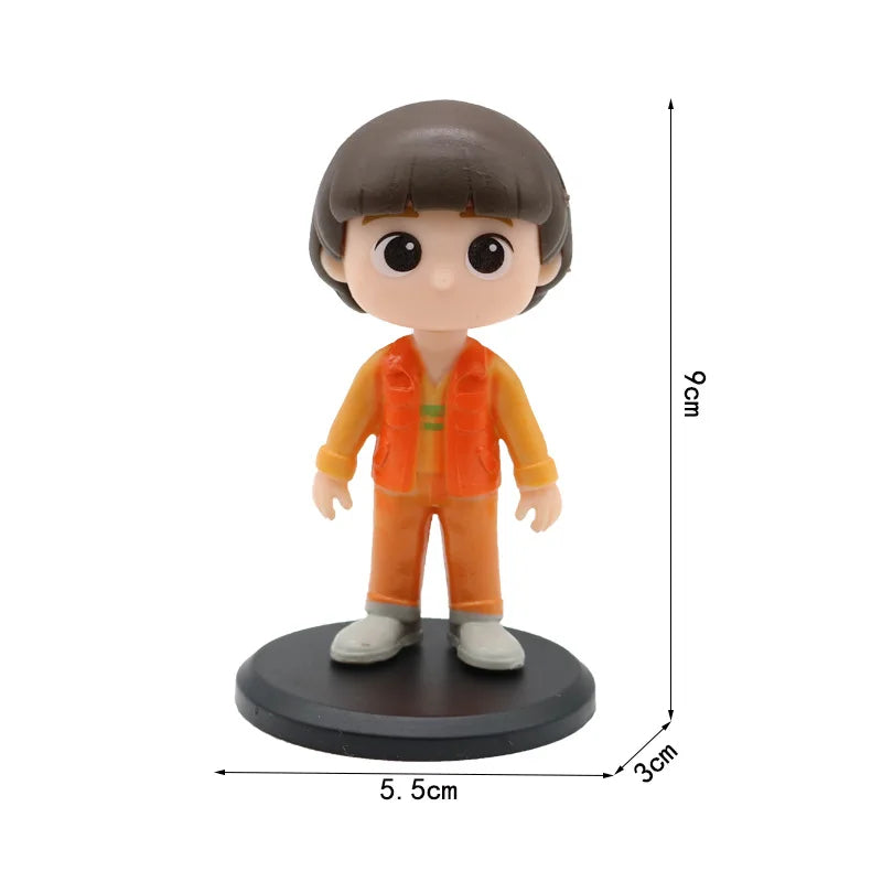 Small figurine with dimensions labeled on a white background