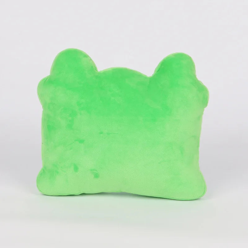 A bright green plush pillow with a soft, fuzzy texture, photographed against a clean white background.