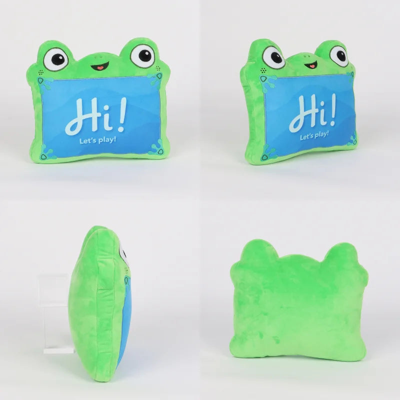 A plush frog-shaped pillow shown from multiple angles on a white background. The front view shows a bright green frog outline with large cartoon eyes and a blue center panel that reads “Hi! Let’s play!”.