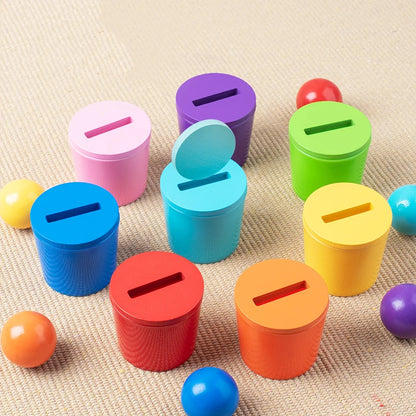 Colorful cylindrical containers with lids on a textured surface