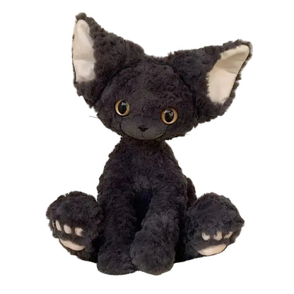 curly devon rex kitten Plush toy cat with black fur and white paws on a light background