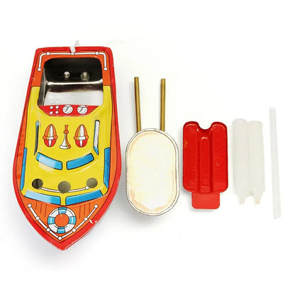 Toy boat with candleaccessories on a white background
