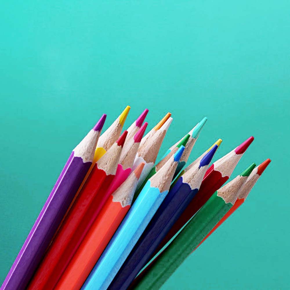 Colorful sharpened pencils on a teal background, toyora stories banner