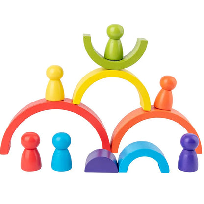 Colorful wooden toy set with arches and figures on a white background